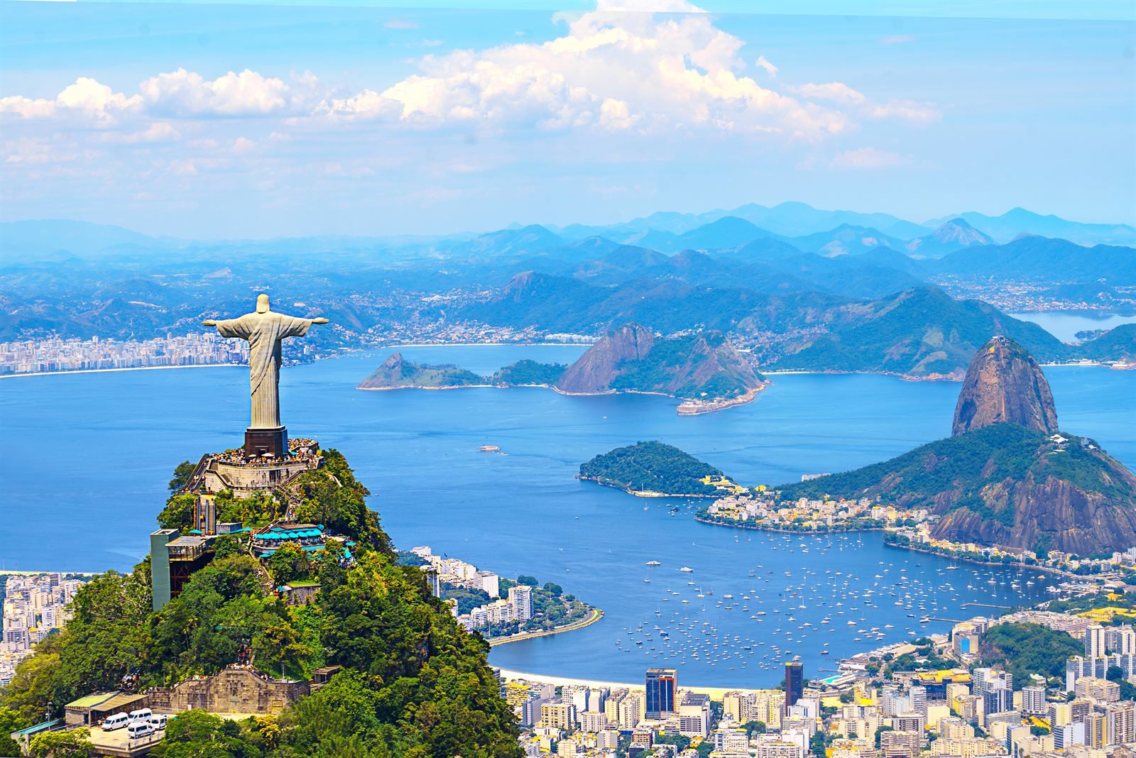 Christ the Redeemer statue on Corcovado overlooking Guanabara Bay, Sugarloaf Mountain and Botafogo marina in Rio de Janeiro